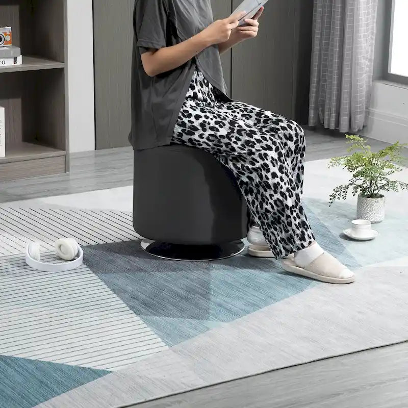 Round Tufted Swivel Ottoman with Padded Seat and Steel Base